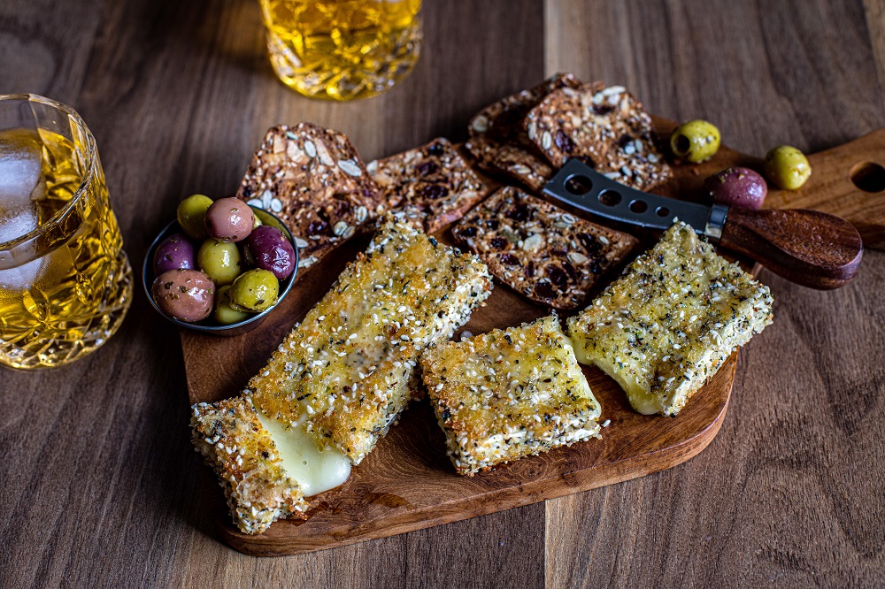 Brie crusted with spices and sesame seeds