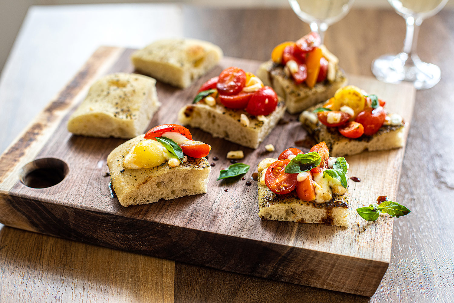 Bruschetta au gratin with tomatoes and mozzarella on focaccia