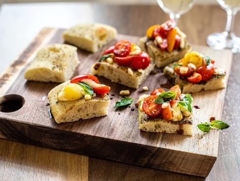 Bruschetta au gratin with tomatoes and mozzarella on focaccia