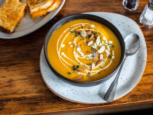 Butternut soup with cream and a crunchy garnish