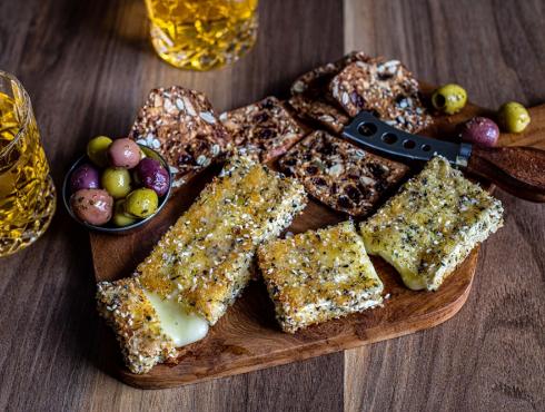 Brie crusted with spices and sesame seeds